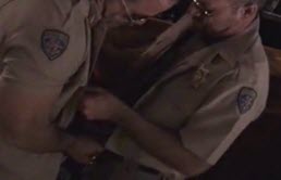 Two horny officers touch each other's cocks